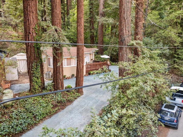 view of gate featuring central AC and a deck