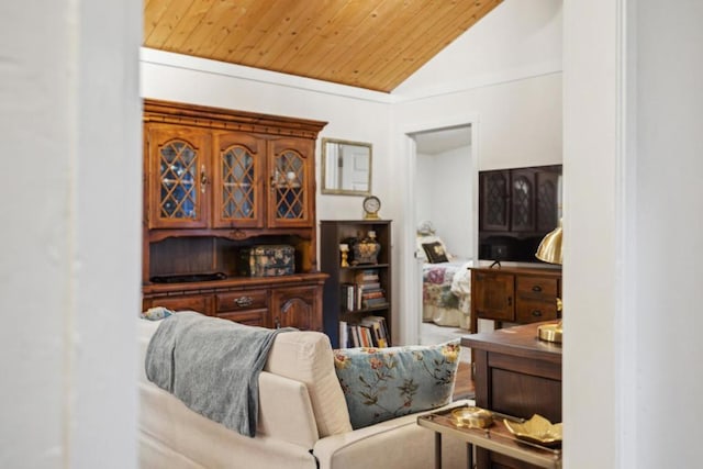 living room featuring vaulted ceiling and wooden ceiling