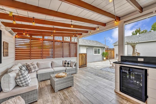 view of patio featuring outdoor lounge area and beverage cooler