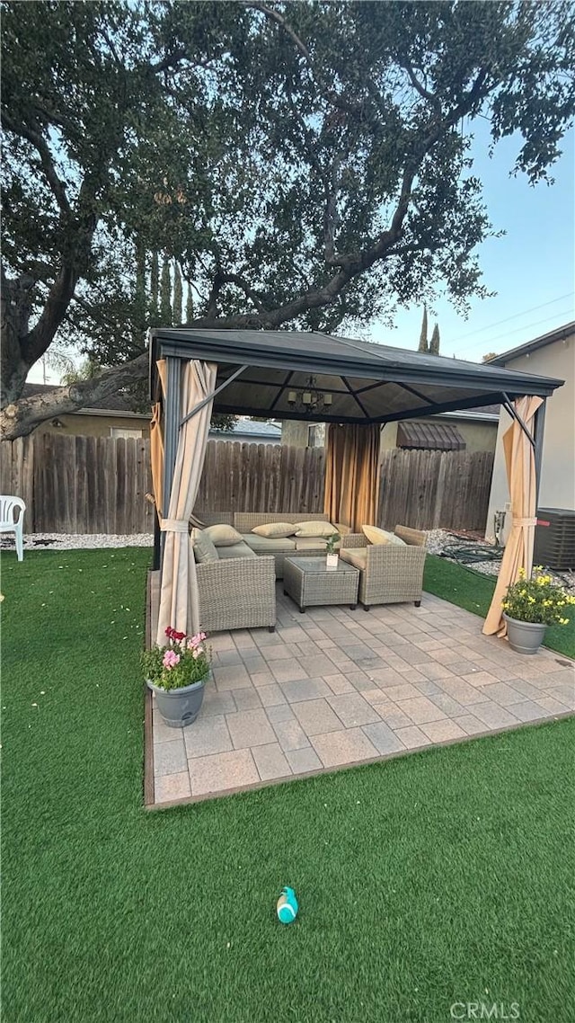 view of patio / terrace featuring an outdoor living space and a gazebo