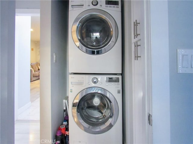 laundry room with laundry area and stacked washing maching and dryer