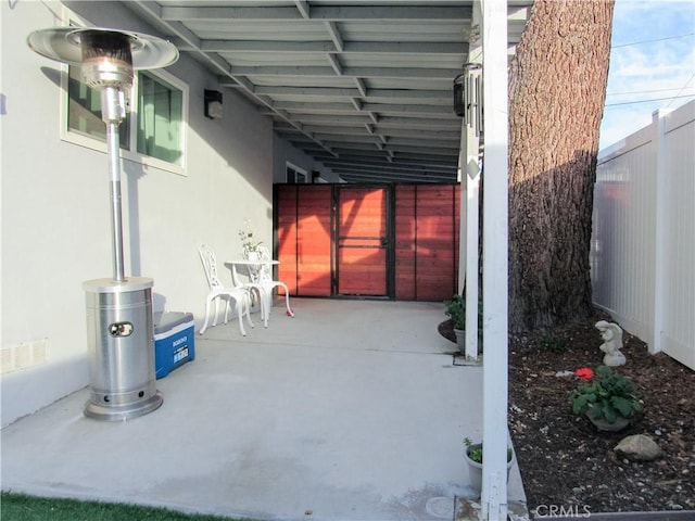 view of patio with a fenced backyard and visible vents