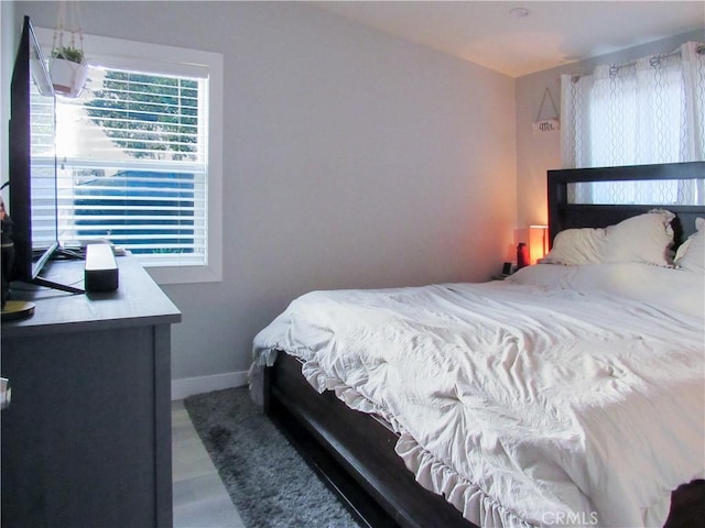 bedroom featuring baseboards