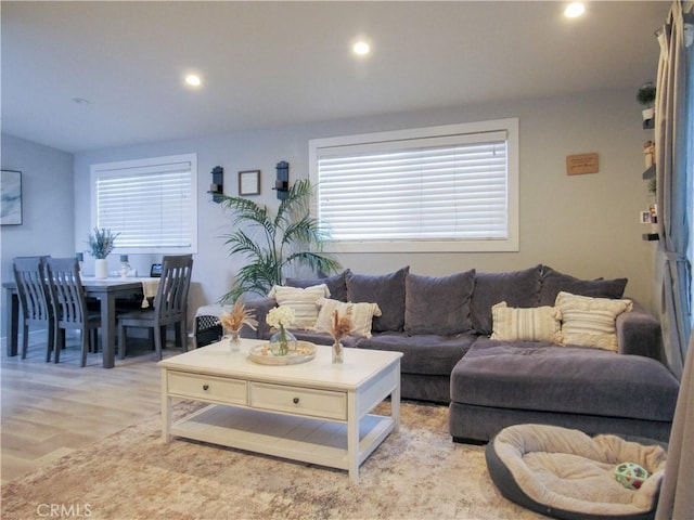 living area featuring light wood-style floors and recessed lighting