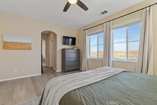 bedroom with ceiling fan and light hardwood / wood-style flooring