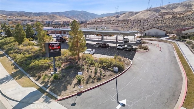 birds eye view of property featuring a mountain view