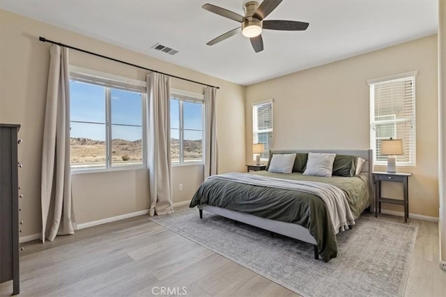 bedroom featuring light hardwood / wood-style flooring and ceiling fan