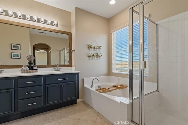 bathroom with vanity, separate shower and tub, and tile patterned flooring