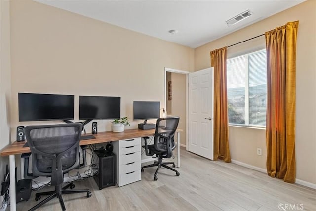 office space featuring light wood-type flooring