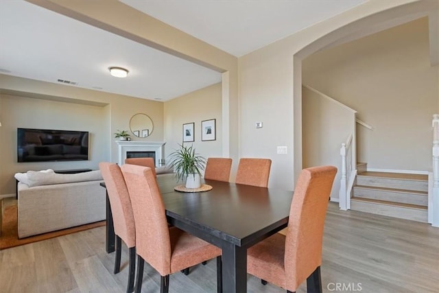 dining space with light hardwood / wood-style floors