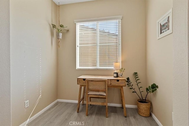 office space with light hardwood / wood-style floors