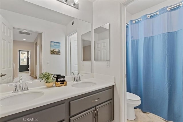 bathroom with tile patterned flooring, vanity, toilet, and a shower with shower curtain