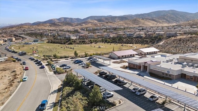 birds eye view of property with a mountain view