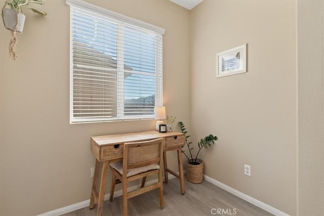 office area with light hardwood / wood-style floors