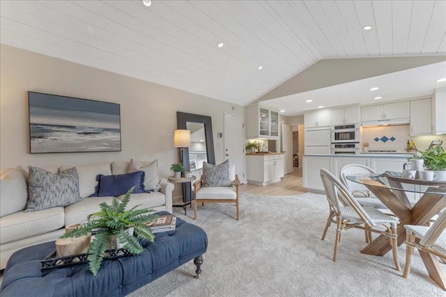 living room with wood ceiling and vaulted ceiling