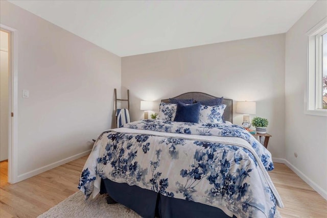 bedroom with light hardwood / wood-style flooring