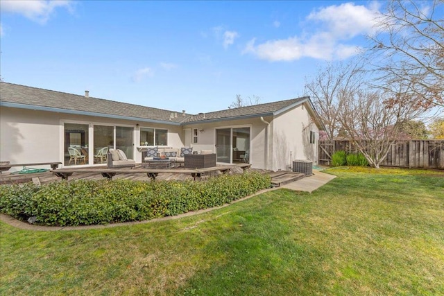 back of property featuring cooling unit, a yard, and an outdoor hangout area