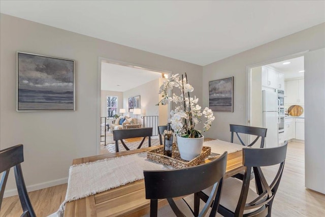 dining room with light hardwood / wood-style flooring