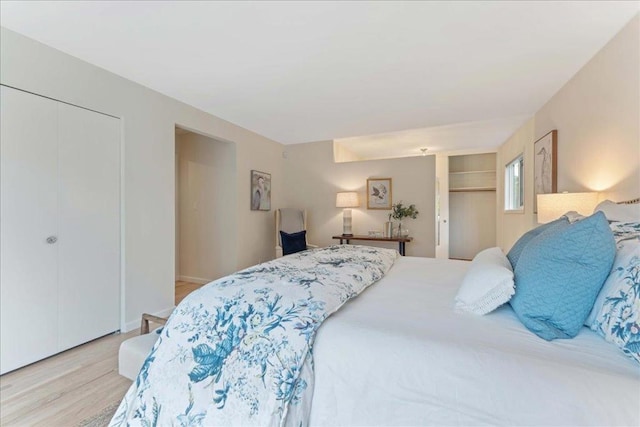 bedroom featuring light hardwood / wood-style floors and a closet