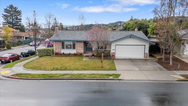 ranch-style home with a garage and a front yard