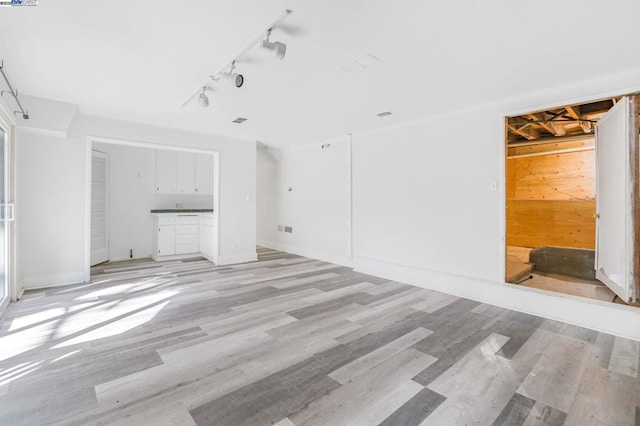 unfurnished living room with light hardwood / wood-style floors