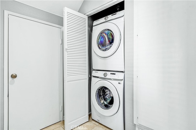 24982 La Pantera, Laguna Niguel, CA 92677 - laundry area featuring stacked washer / dryer, light tile patterned flooring, and laundry area