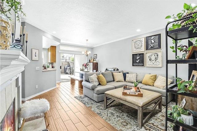 24982 La Pantera, Laguna Niguel, CA 92677 - living room featuring a textured ceiling, baseboards, an inviting chandelier, ornamental molding, and wood finished floors