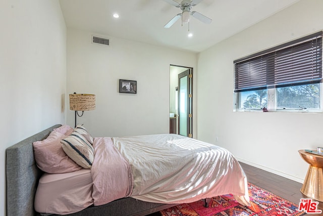 bedroom with wood-type flooring and ceiling fan