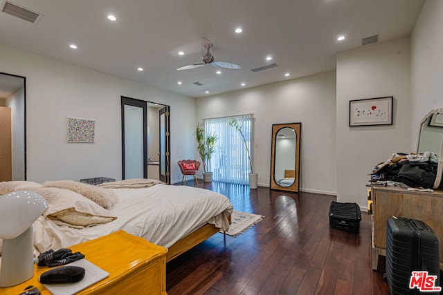 bedroom with dark wood-type flooring