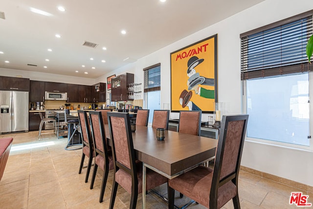 dining space with light tile patterned floors