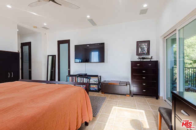 bedroom with access to outside and light tile patterned floors