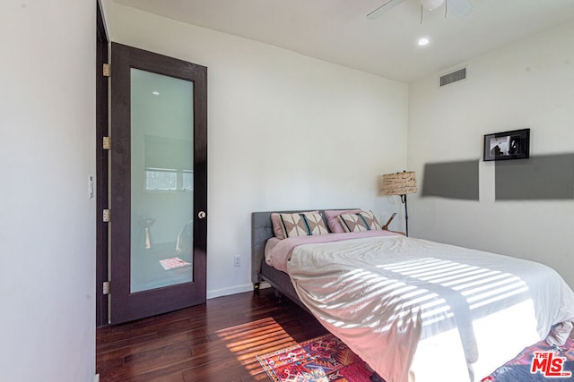 bedroom featuring dark hardwood / wood-style floors and ceiling fan