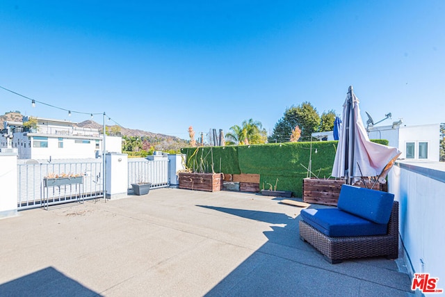 view of patio / terrace with a mountain view