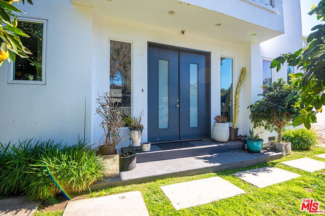 doorway to property featuring a balcony