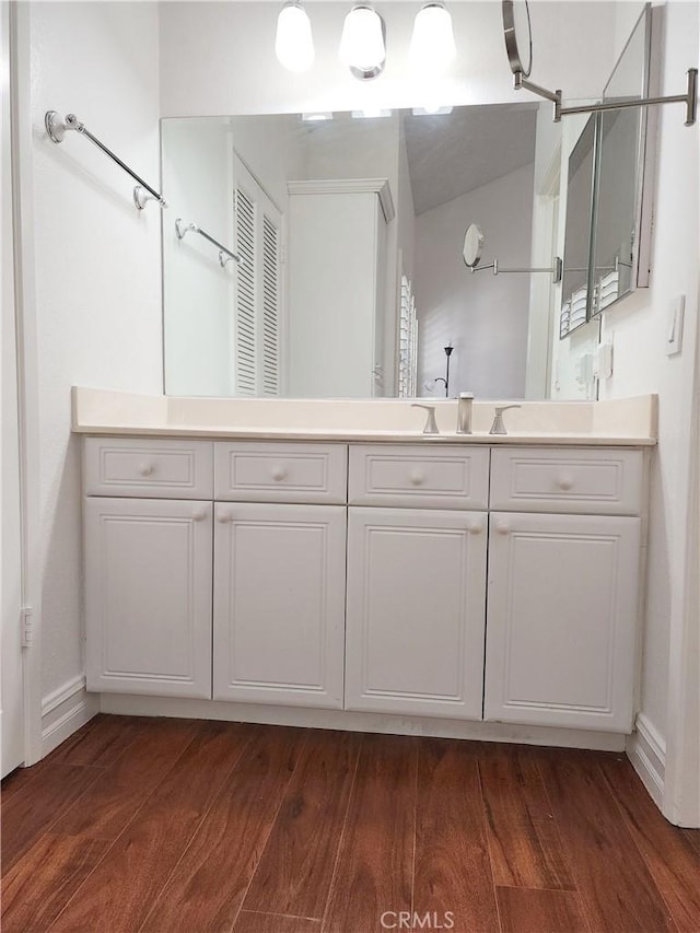 bathroom featuring wood-type flooring and vanity