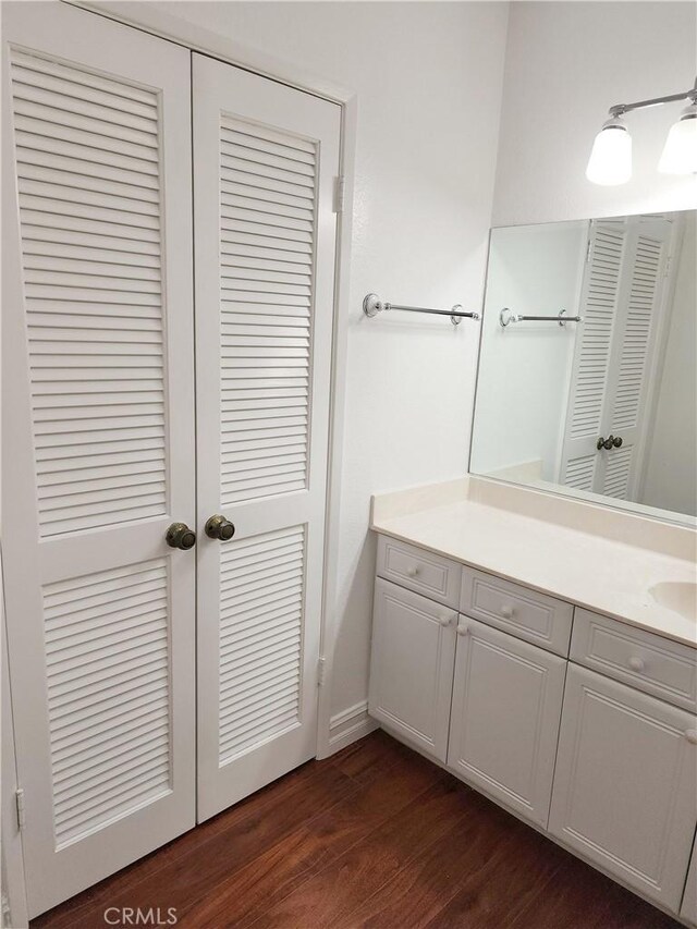 bathroom featuring hardwood / wood-style flooring and vanity