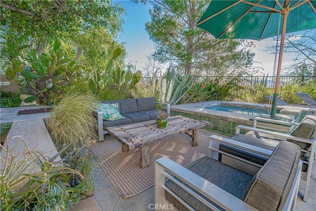 view of patio / terrace featuring outdoor lounge area and an outdoor hot tub