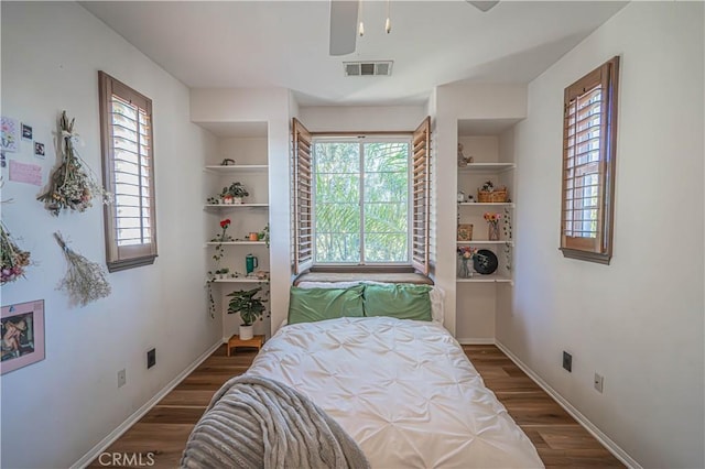 bedroom featuring dark wood-type flooring and ceiling fan