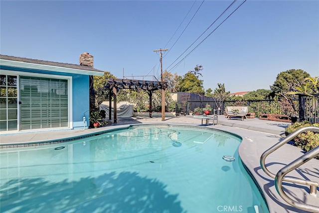 view of pool featuring a patio and a pergola