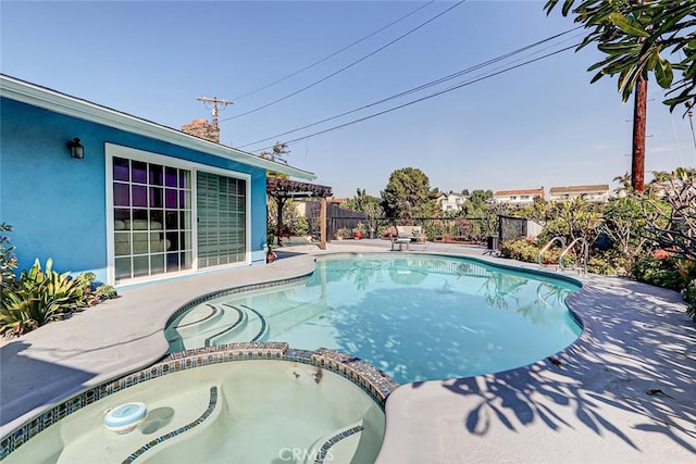 view of swimming pool with an in ground hot tub and a patio