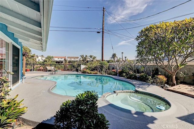 view of pool featuring an in ground hot tub and a patio area