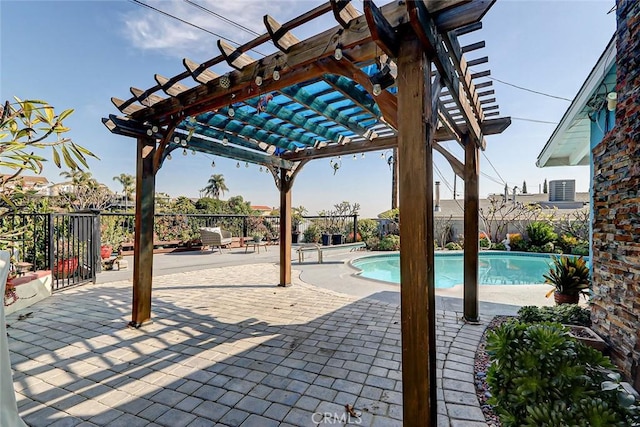 view of swimming pool with a pergola and a patio