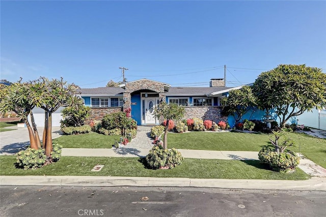 ranch-style house with a garage and a front yard