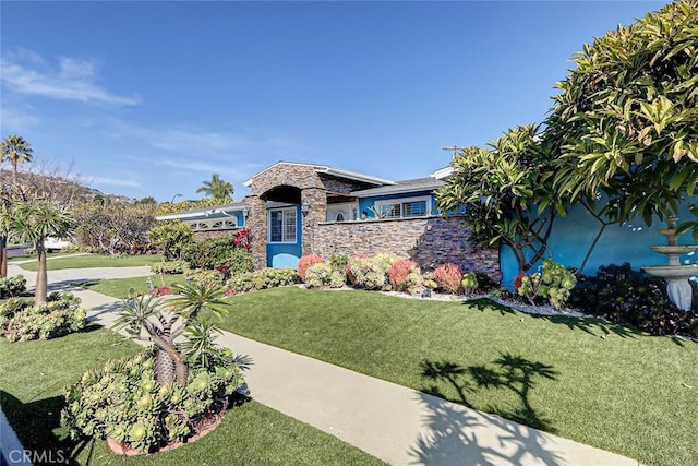 view of front facade with a garage and a front lawn