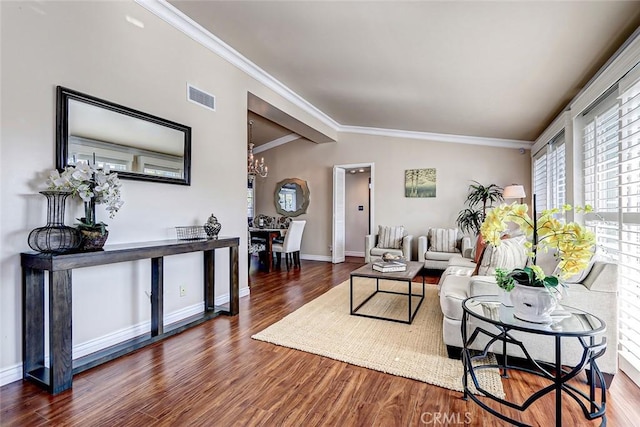 living room with ornamental molding, vaulted ceiling, and dark wood-type flooring