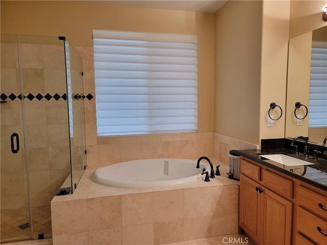 bathroom with vanity and plus walk in shower