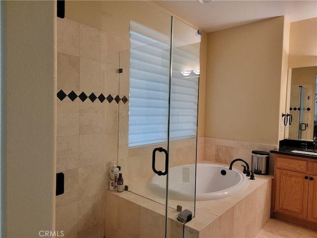 bathroom with vanity, shower with separate bathtub, and tile patterned flooring