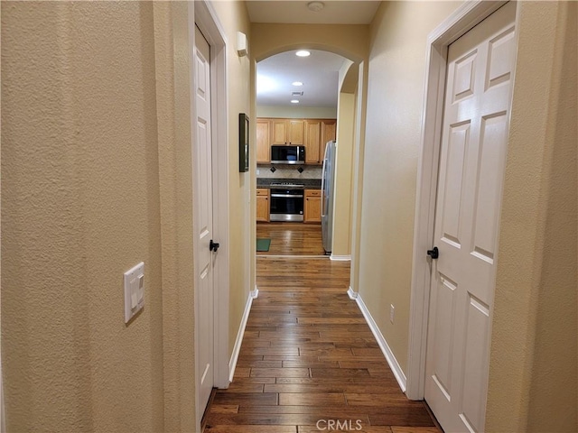 hallway featuring dark hardwood / wood-style flooring