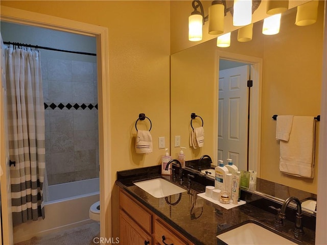 full bathroom featuring shower / tub combo with curtain, vanity, and toilet