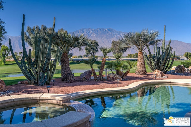 view of swimming pool featuring a mountain view